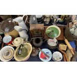 Enamel jugs, together with storage bins, teapot, clock, saucepans,