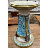 A Wedgwood majolica jardiniere stand, in cream, and turquoise moulded with flowers and leaves,