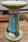 A Wedgwood majolica jardiniere stand, in cream, and turquoise moulded with flowers and leaves,
