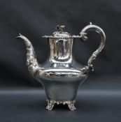 A Victorian silver coffee pot, with a flower and leaf finial above a baluster body,