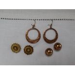 A pair of 9ct yellow gold domed earrings, together with a pair of 9ct gold hoop earrings,