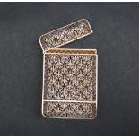 A white metal filigree card case of rectangular form, of floral design, 87mm high,