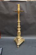 A large brass alter candlestick,