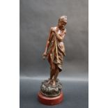 After J Garnier A scantilly clad maiden Bronze on a stepped marble base 23cm high