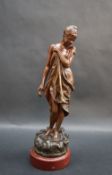 After J Garnier A scantilly clad maiden Bronze on a stepped marble base 23cm high