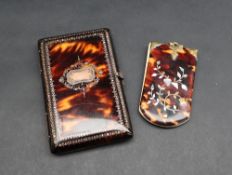 A tortoiseshell note case of rectangular form, inlaid with yellow metal and mother of pearl,