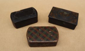 A papier mache snuff box of rectangular form with tartan decoration,