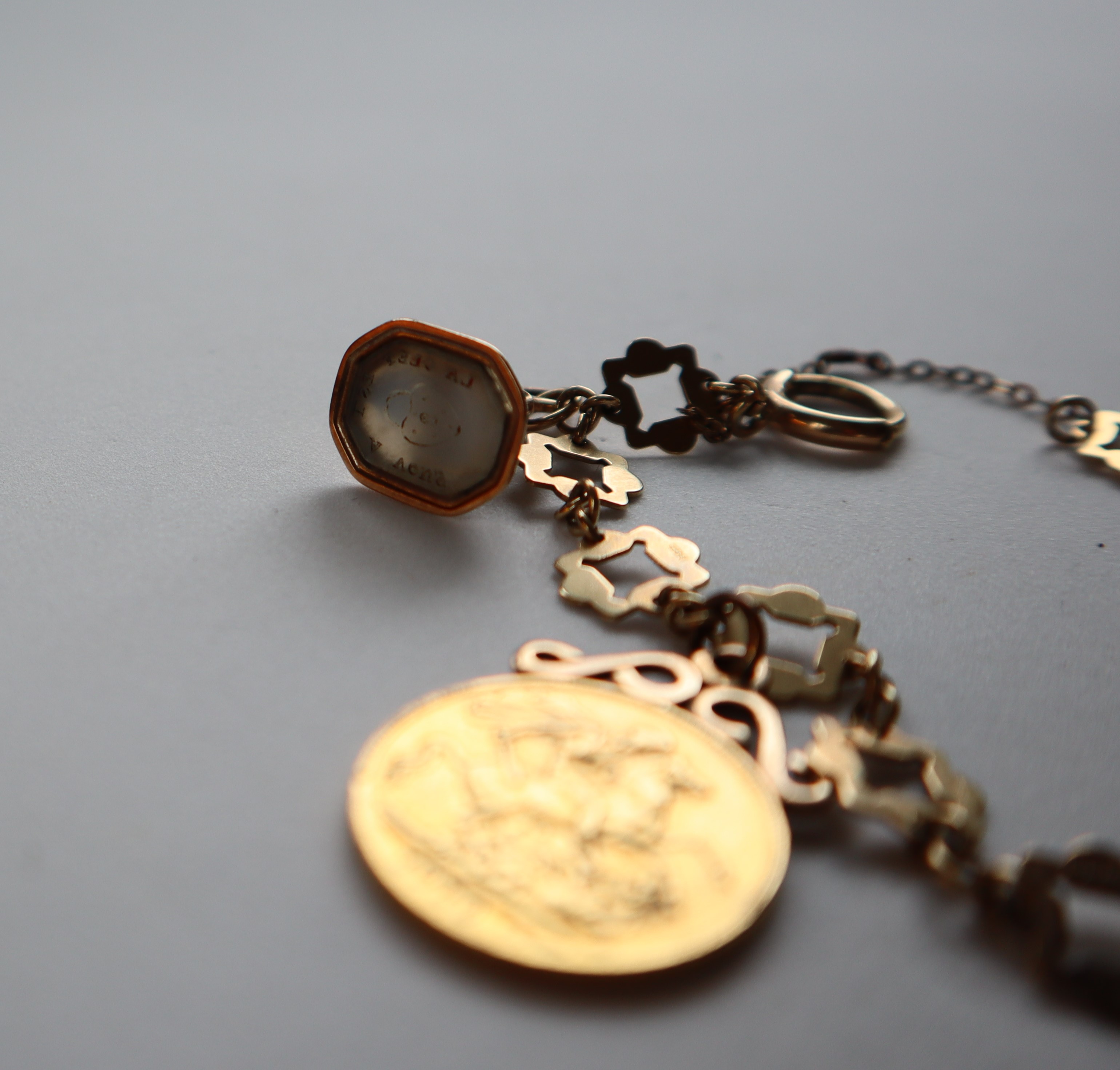 A 9ct yellow gold bracelet, set with two Edward VII gold sovereigns, - Image 2 of 3