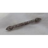 A Victorian diamond bar brooch, set with round old cut diamonds to a white metal wirework setting,