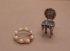 A 14k yellow gold pearl set brooch of circular form together with a miniature silver chair