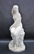 A Minton parian figure of Miranda designed by John Bell (1811-1895) modelled seated on a rocky