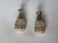 A pair of continental white metal diamond set drop earrings,