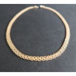 An 18ct yellow and white gold necklace, with crossing links, 43.5cm long, approximately 32.
