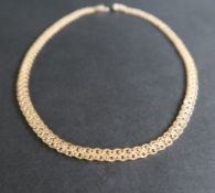 An 18ct yellow and white gold necklace, with crossing links, 43.5cm long, approximately 32.