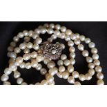 A three strand pearl necklace / choker,