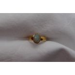 A 22ct yellow gold ring, set with an opal, size M 1/2, approximately 4.