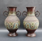 A pair of Japanese bronze champleve enamel twin handled vase with geometric decoration to the