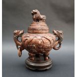 A Chinese hardstone urn and cover with a dog of foo finial,
