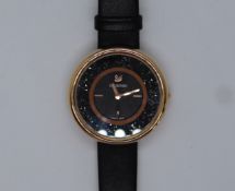 A lady's stainless steel Swarovski wristwatch,