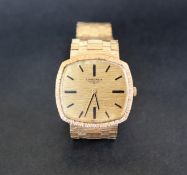 A gentleman's 9ct yellow gold Longines wristwatch, with a shaped dial and batons, 33mm wide,