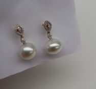 Gemporia - A pair of South Sea cultured pearl and diamond 18k gold earrings, metal 2.