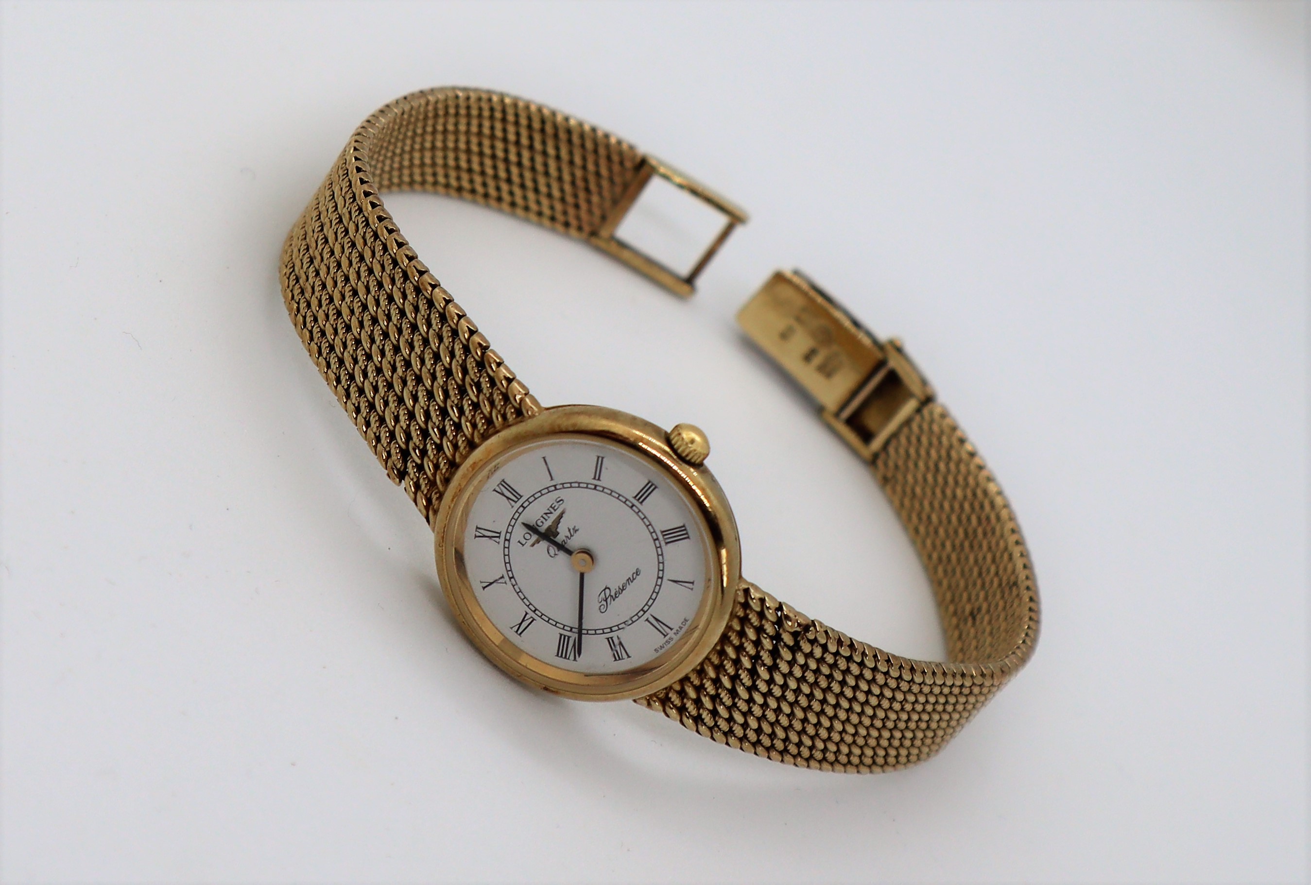 A lady's 9ct yellow gold Longines Presence wristwatch, with a circular dial and Roman numerals, - Image 3 of 5