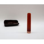 A 9ct gold mounted amber cheroot holder, cased, the case inscribed AS Clubb & Sons,