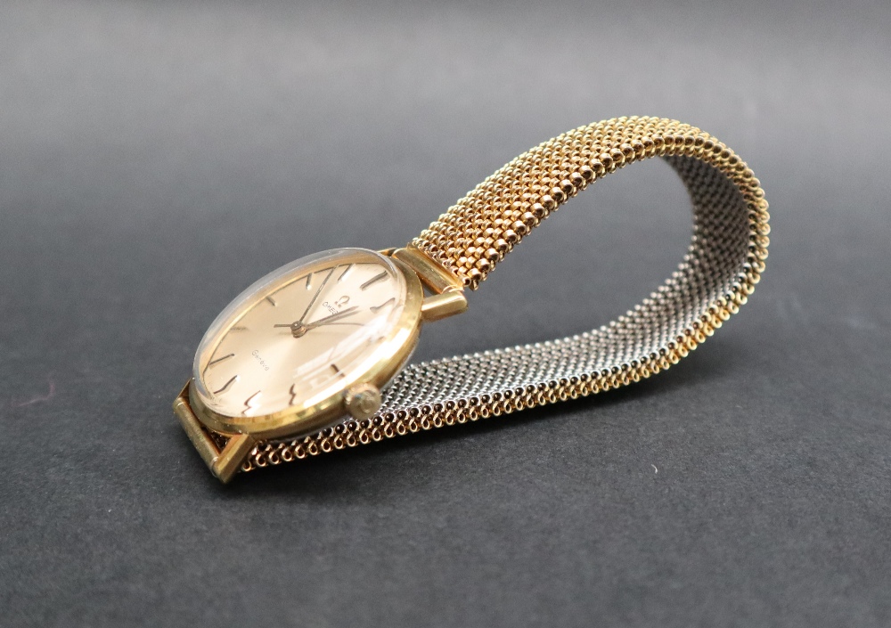 A Gentleman's yellow metal Omega Geneve wristwatch, with a silvered dial and batons, - Image 2 of 6