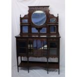 An Edwardian mahogany chiffonier, with a central circular mirror, other mirrors and shelves,