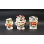 Three assorted 19th century Staffordshire bacchus / satyr faced jugs,