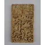 A 19th century Chinese Canton carved ivory visiting card case , profusely carved with figures,