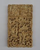 A 19th century Chinese Canton carved ivory visiting card case , profusely carved with figures,