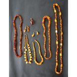 A collection of Baltic amber necklaces, earrings and pendants,