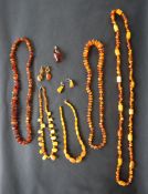 A collection of Baltic amber necklaces, earrings and pendants,