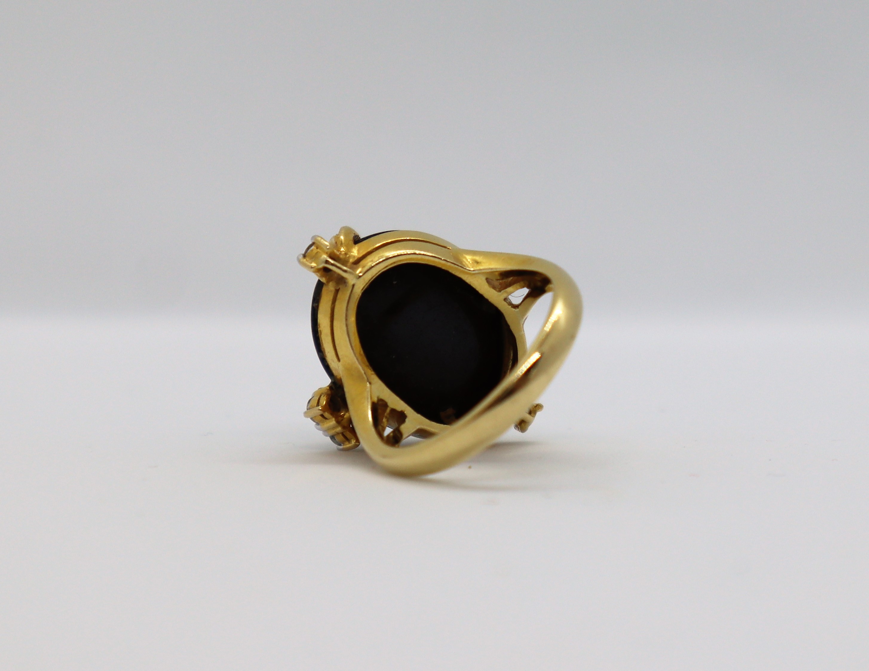 A diamond and cabochon onyx dress ring, - Image 6 of 7