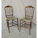 A pair of brass Chiavari brass dining chairs, with a shaped spindle back,