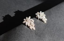 A pair of diamond drop earrings of leaf shape,