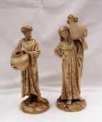 A pair of Royal Worcester figures of water carriers, No.