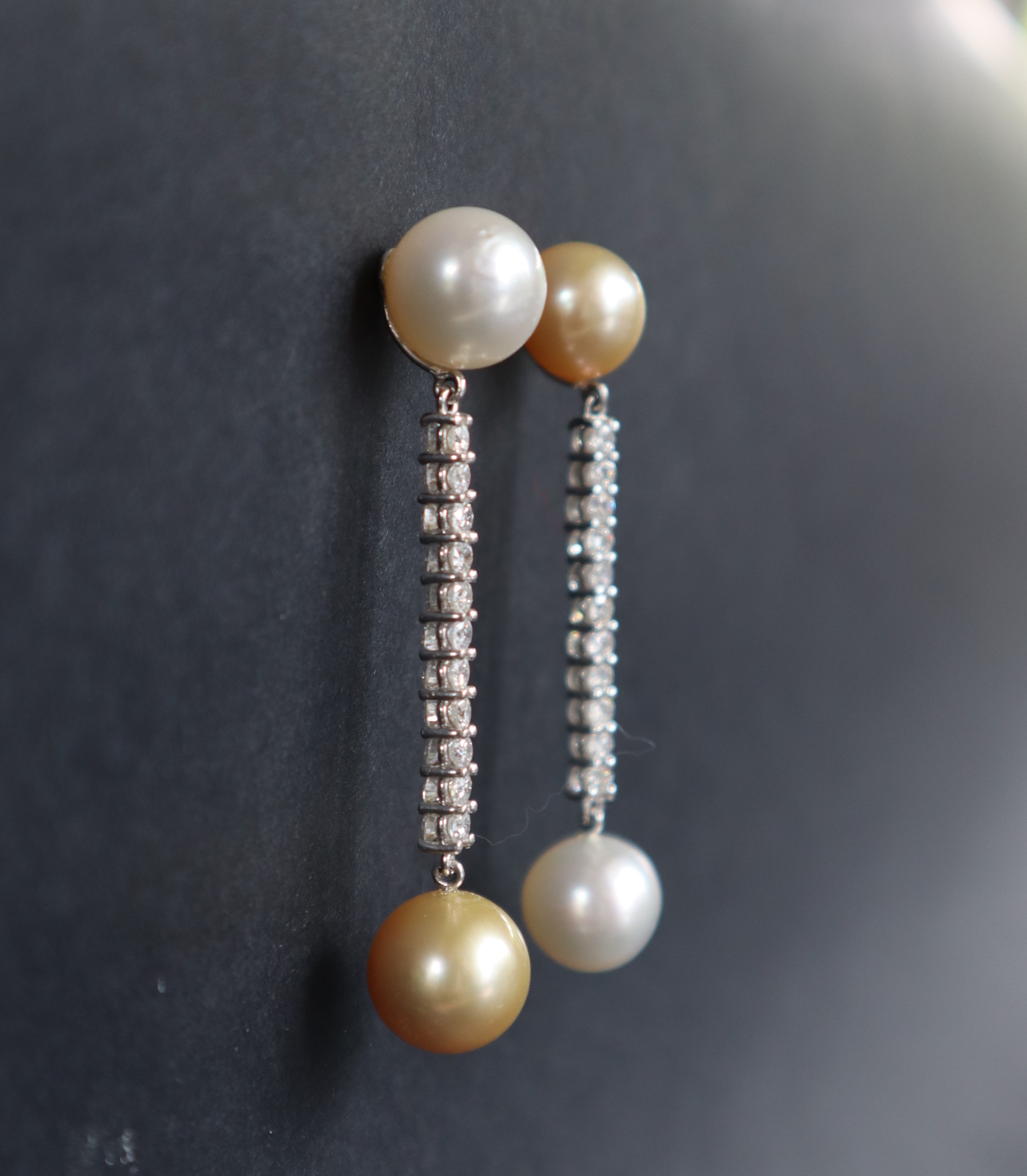 A pair of diamond and pearl drop earrings, set with a large yellow and white pearl, - Image 2 of 3