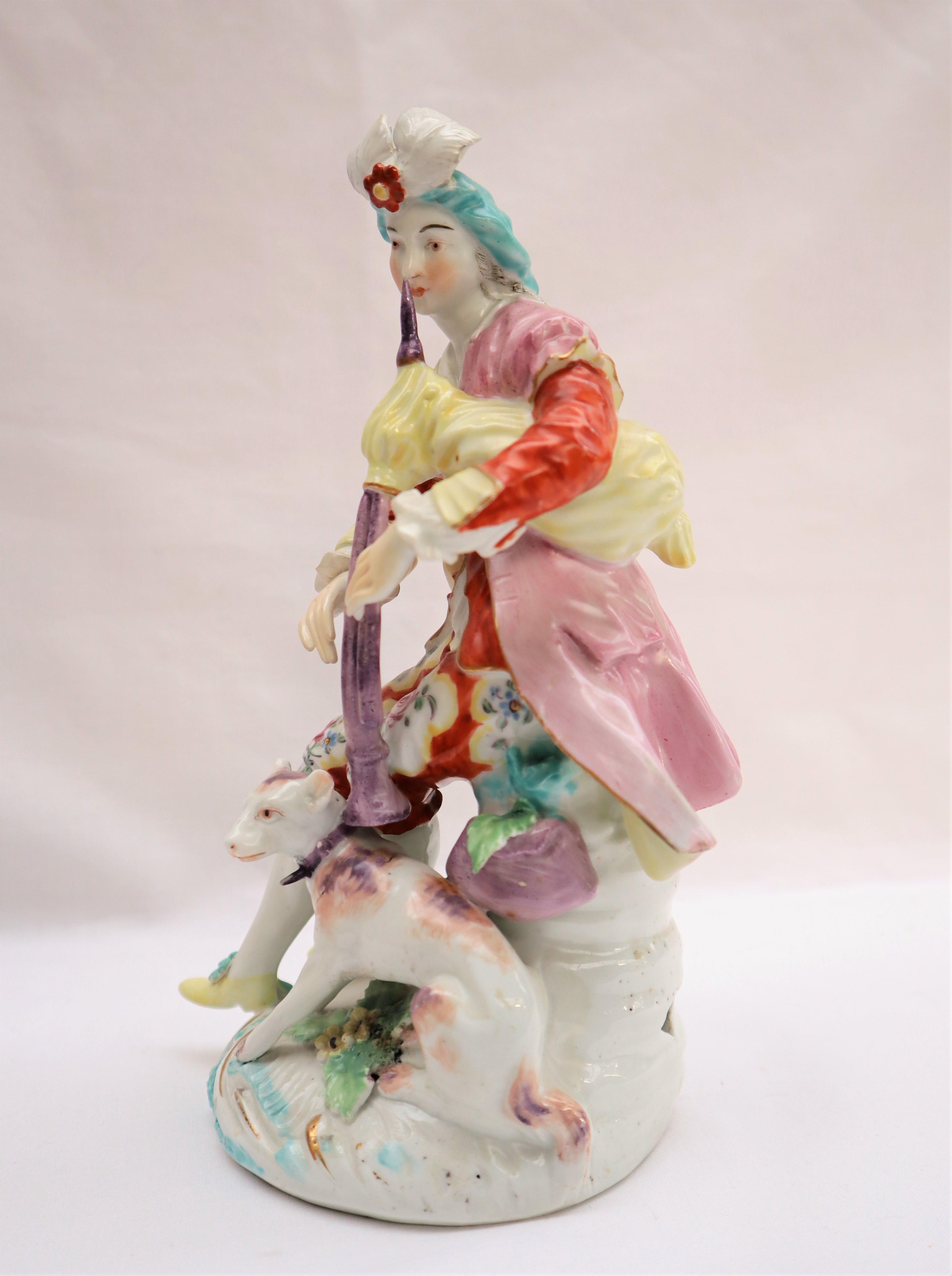 A Derby porcelain figure seated playing bagpipes with a dog at his feet on a circular base, 19. - Image 6 of 8