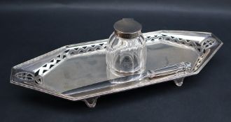 An Edward VII silver ink stand, of pointed oval form, with a silver topped glass inkwell, London,