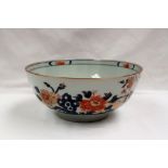 A Chinese porcelain bowl, painted with large flowerheads and leaves,