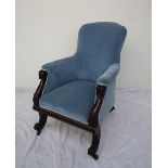 A William IV mahogany framed library chair with a sloping back above a pad seat with lotus leaf