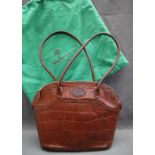 A Mulberry brown leather faux crocodile handbag together with a similar purse with a box for the