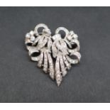 A diamond set double clip brooch,