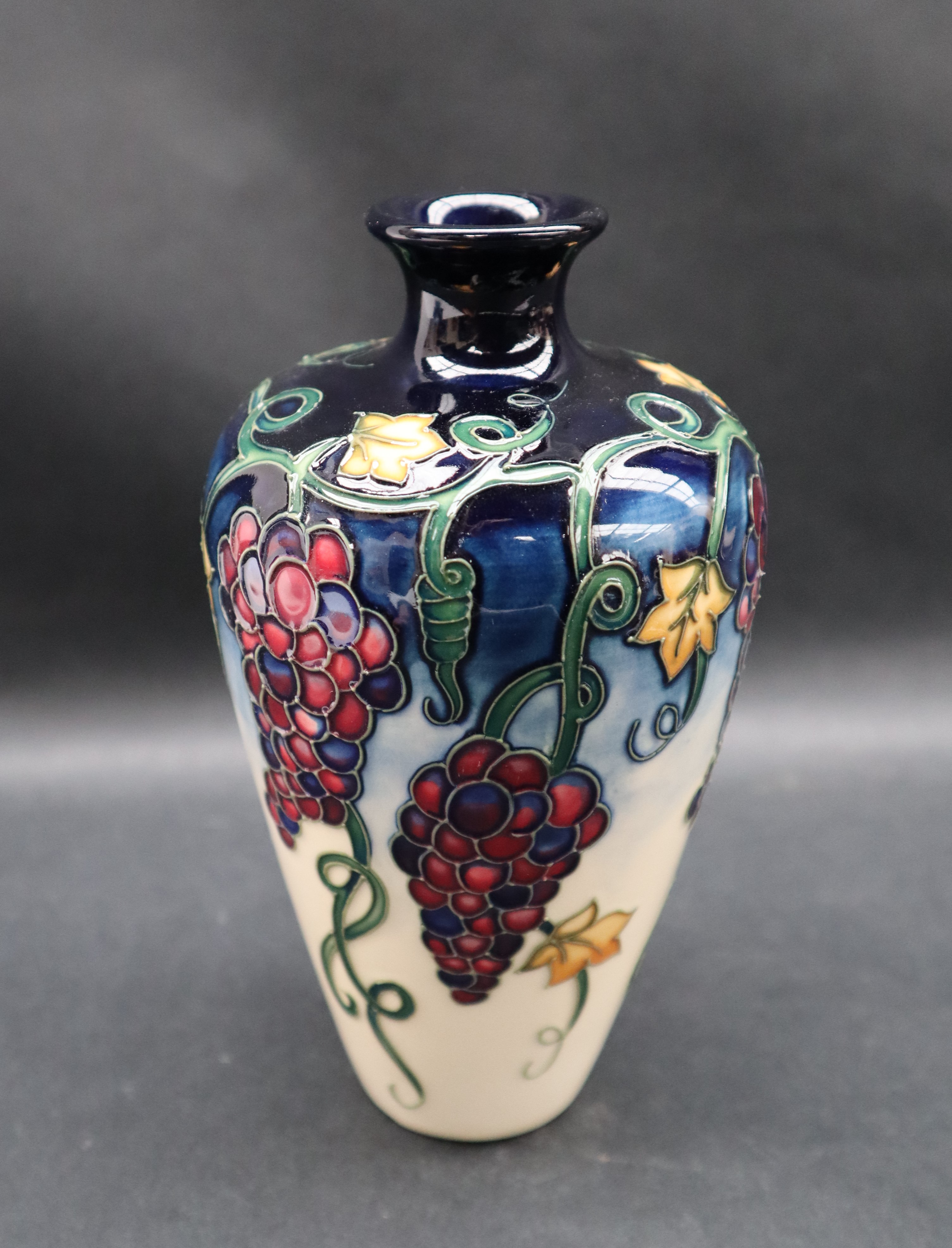 A Moorcroft pottery vase decorated with bunches of grapes and leaves to a cream ground, - Image 2 of 6