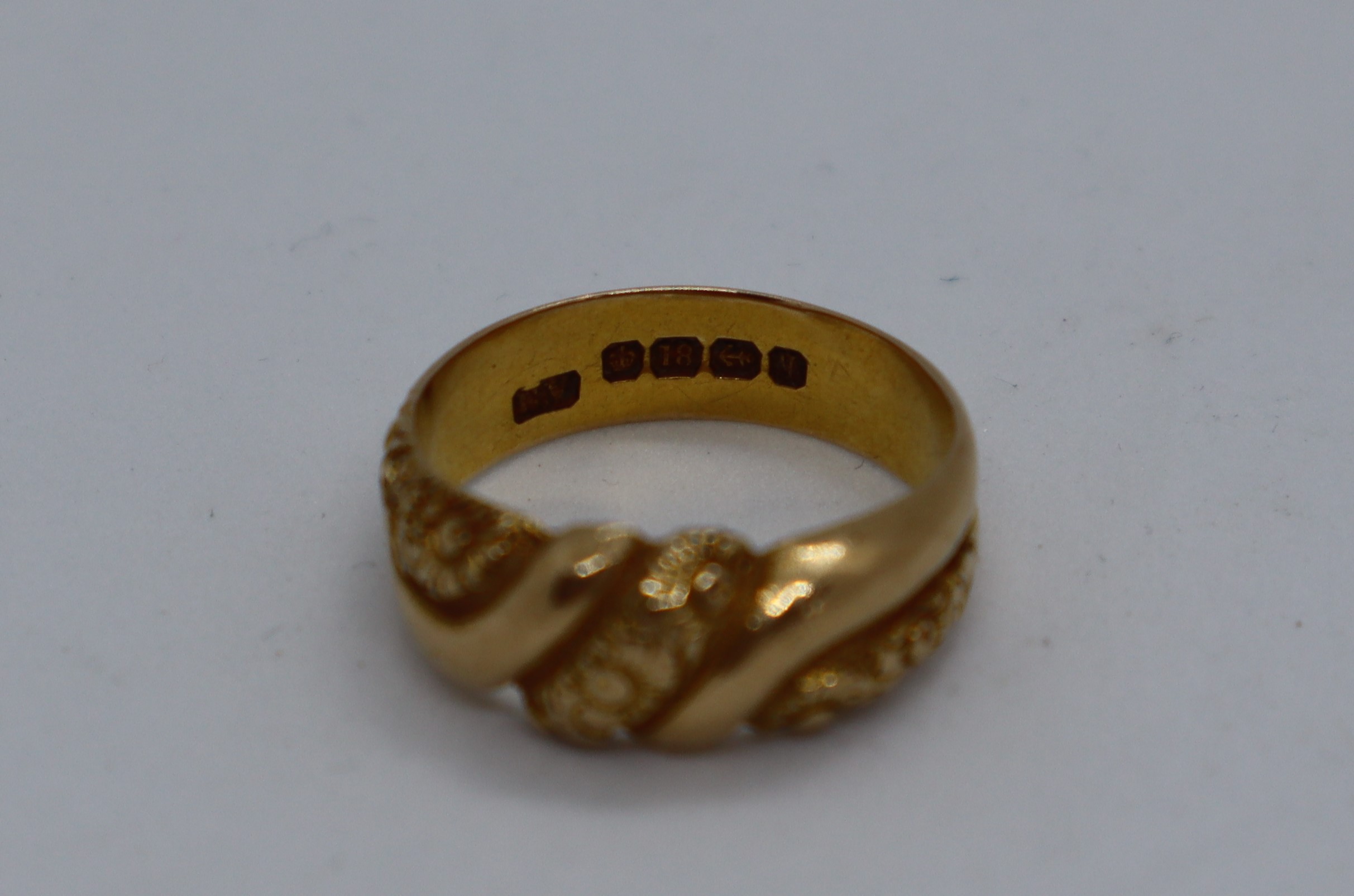 An 18ct yellow gold ring, cast with flowerheads, - Image 2 of 3