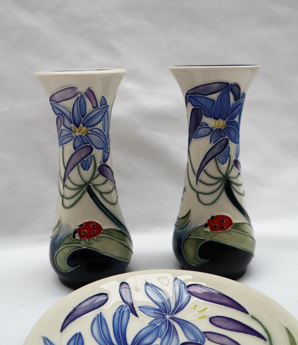 A pair of Moorcroft pottery vases painted in the Fly Away Home pattern,