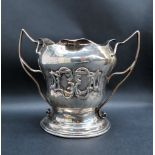 A late Victorian Art Nouveau inspired twin handled trophy cup,