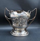 A late Victorian Art Nouveau inspired twin handled trophy cup,